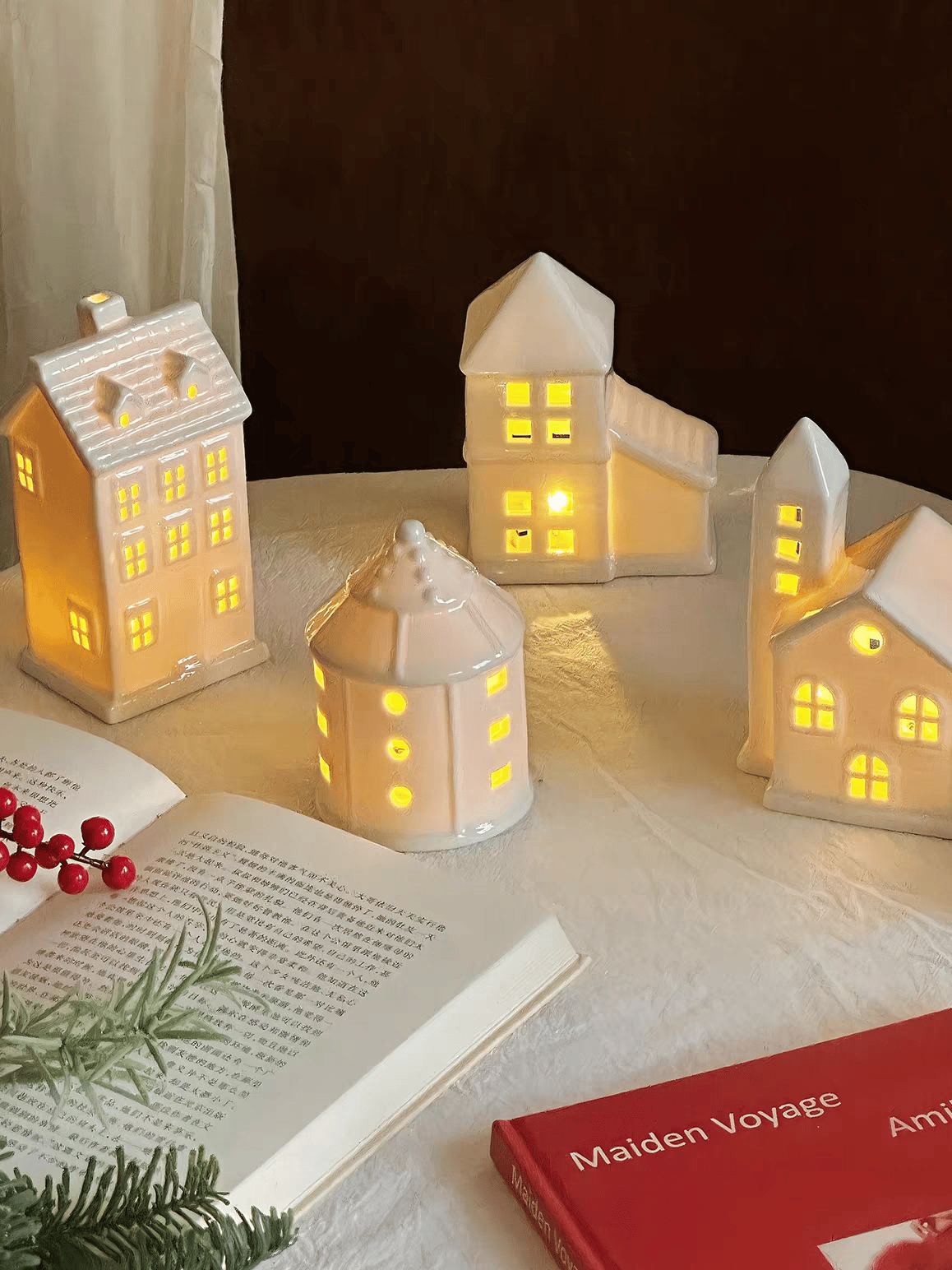 A Set of 4 Light-Up Ceramic Christmas Village Houses